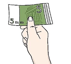 Eine Hand gibt Geld
